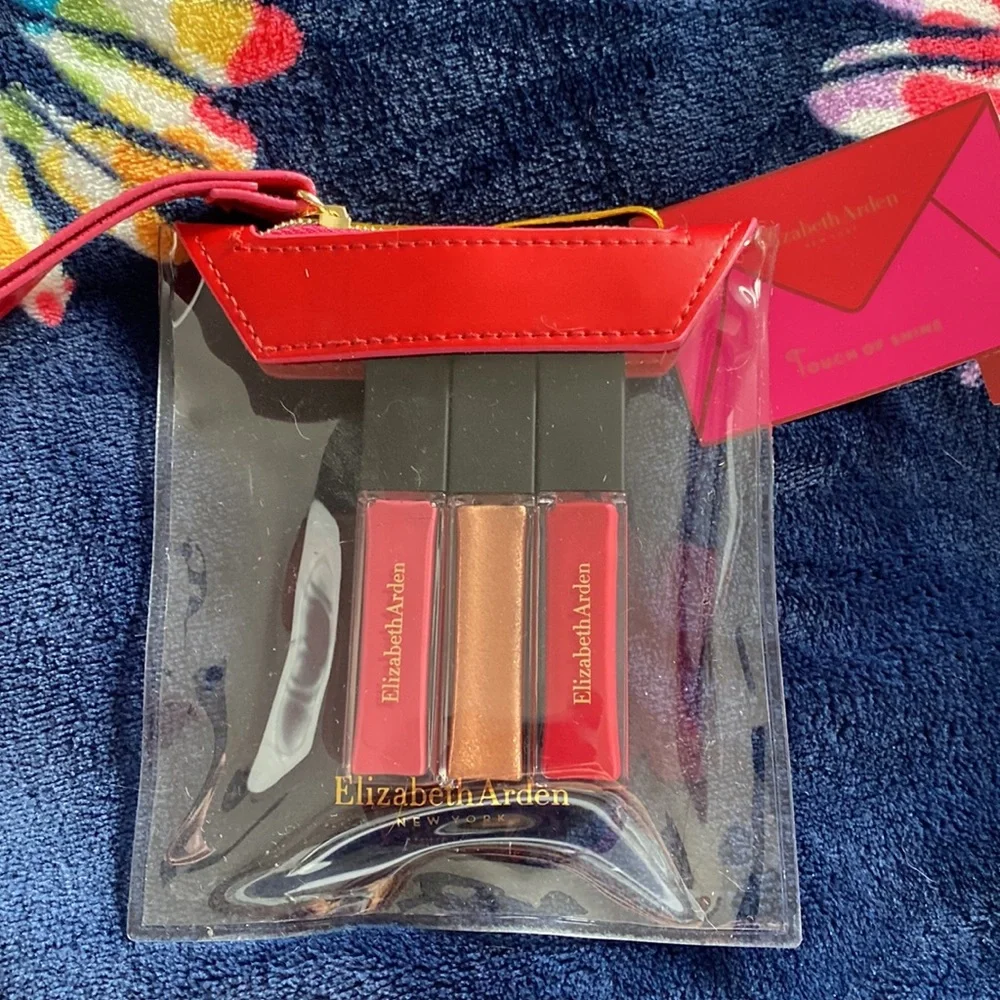 New Elizabeth Arden touch of shine set of three lip glosses